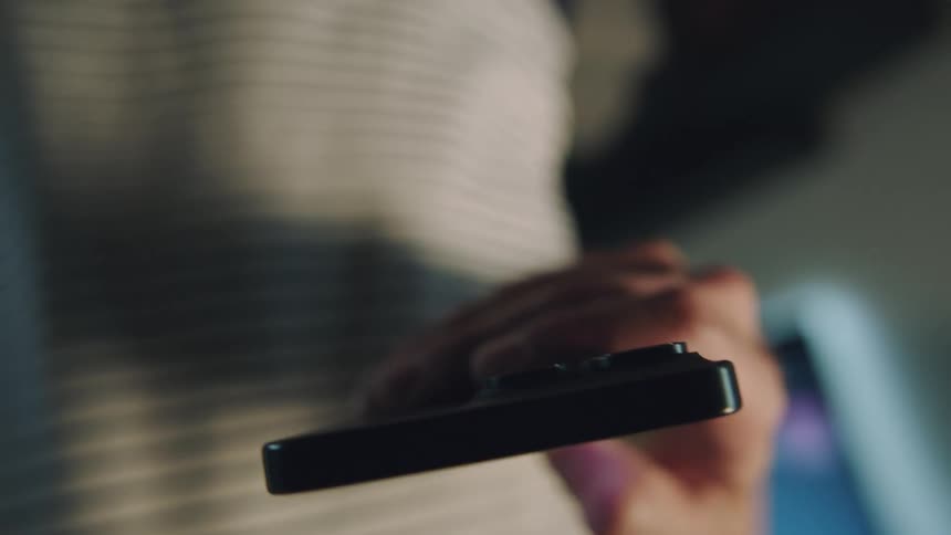 Persons hand using an iphone