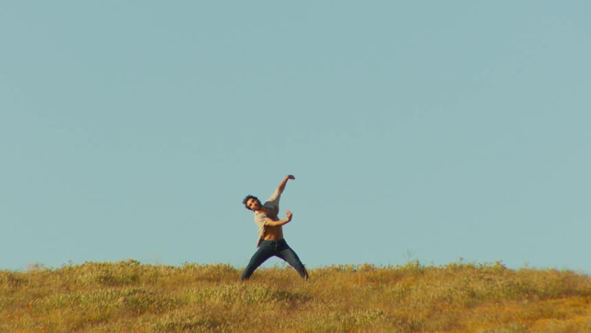 A man is dancing in the distance