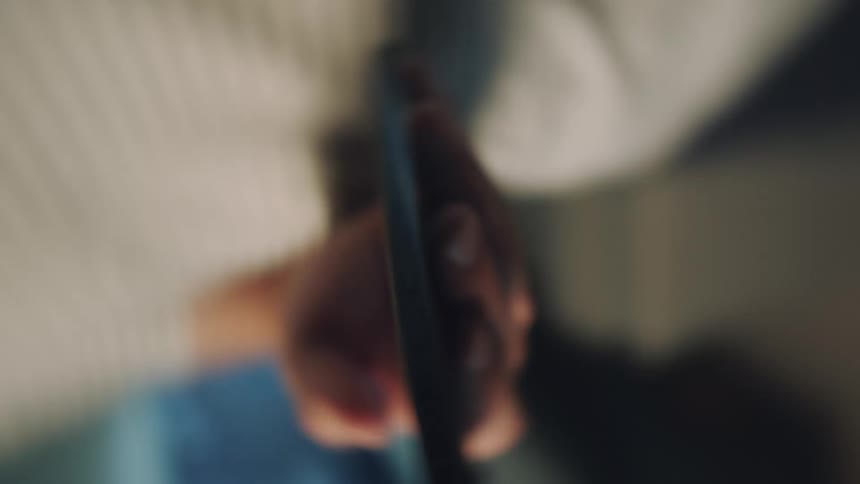 A person is swiping on their cell phone