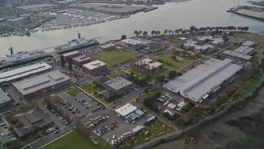 Aerial panorama of an island with a logistics center and boats around it