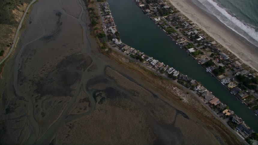 A row of homes are on the shore line