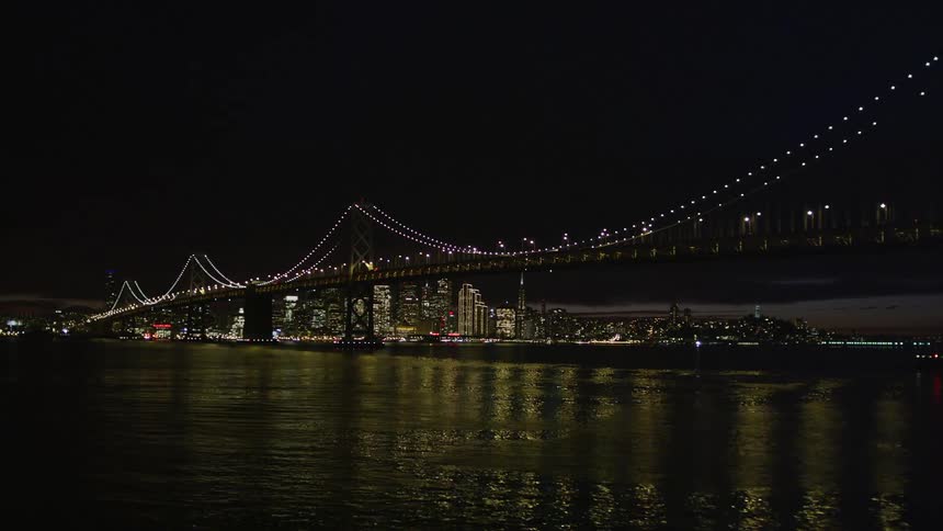 A view of a bridge outdoors at night