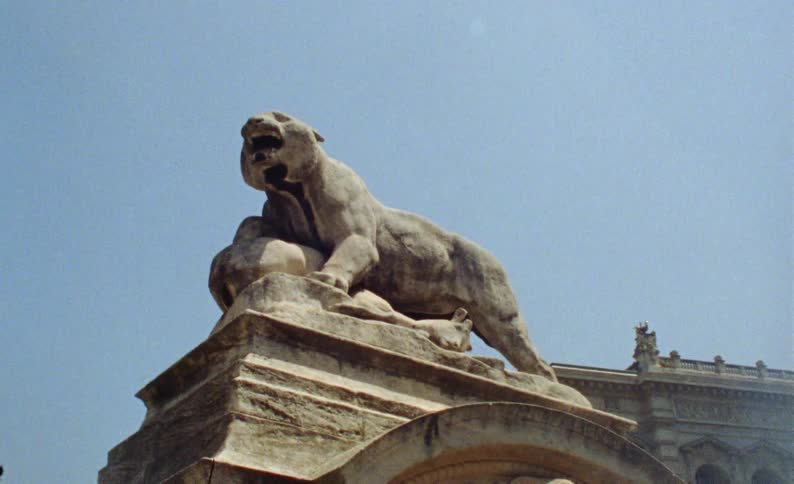 Artistic monument of an animal on a pillar in a historic center