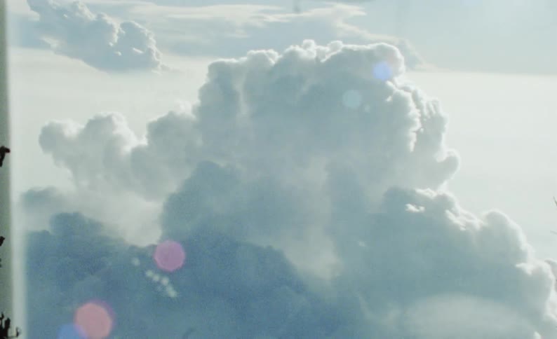 Heavy clouds are outside the plane window