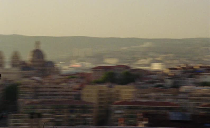 A city with a domeshaped cathedral and several smaller houses and buildings in front