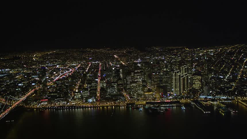 A giant coastal city lit up at night