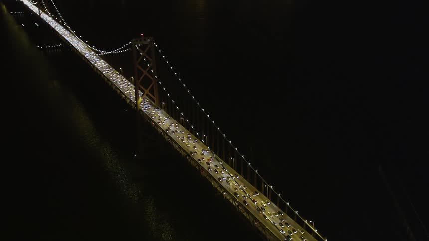 Aerial view of traffic over san francisco bridge at night
