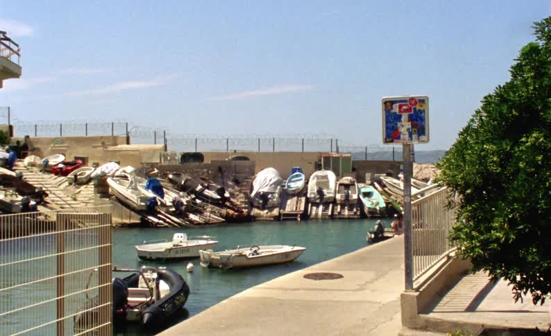 Small boats are all parked in the marina
