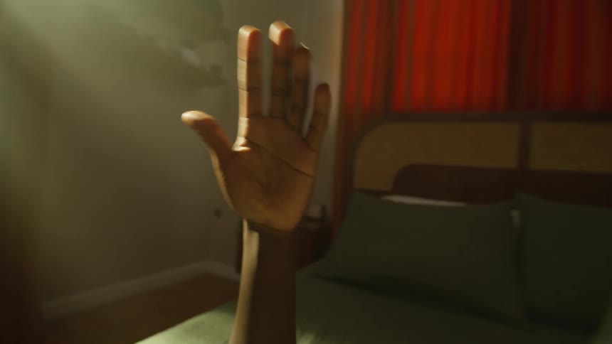 Closeup of a mans hands moving around in a bedroom environment