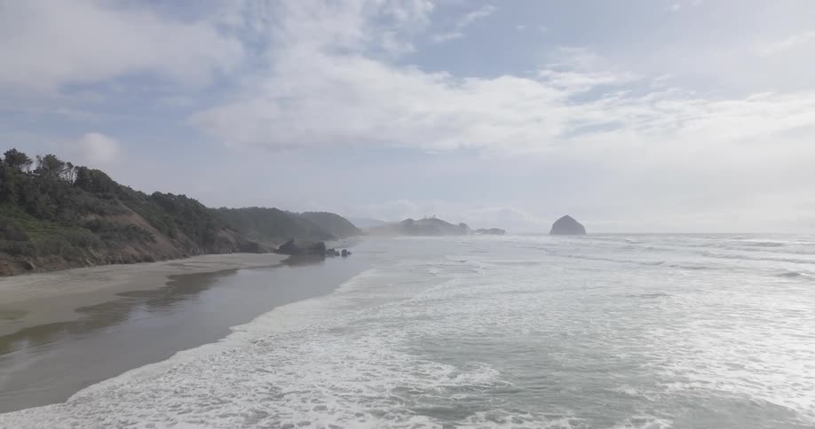 Waves move to a beach