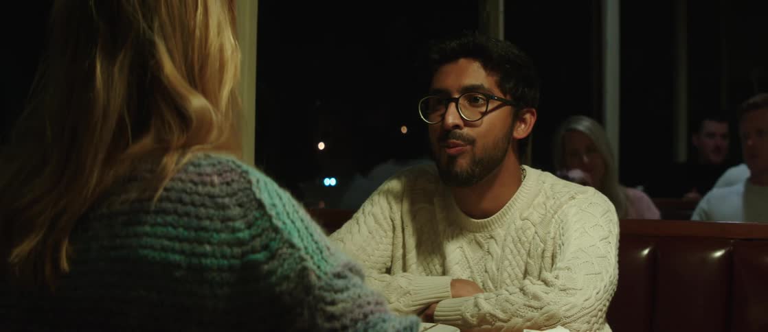 A couple sits in a restaurant talking
