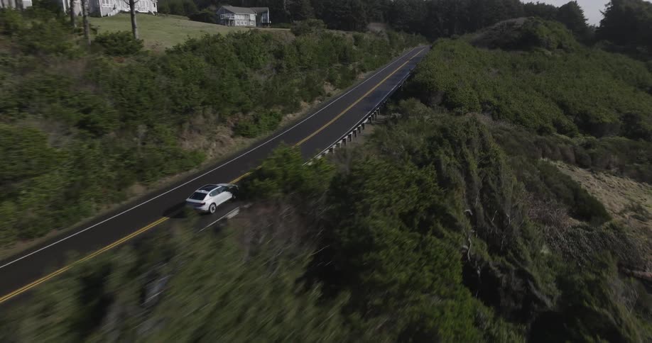 A car is driving on the highway on the hills