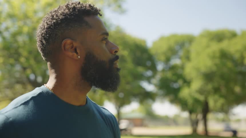 A man is walking in the park