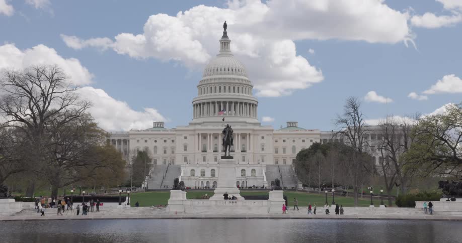 Tourists walk around outside the capitol building