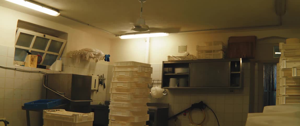 A backroom filled with trays for food