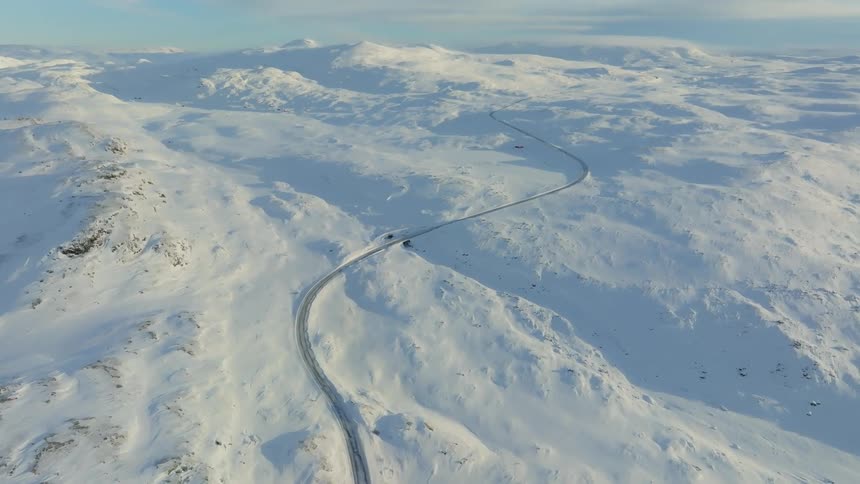 A road runs over the mountains
