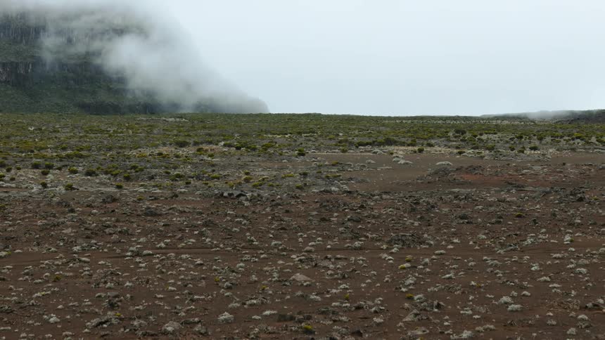 Clouds float near a plateau