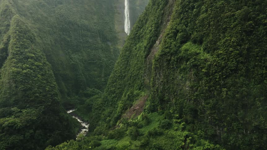 A river runs between huge mountains