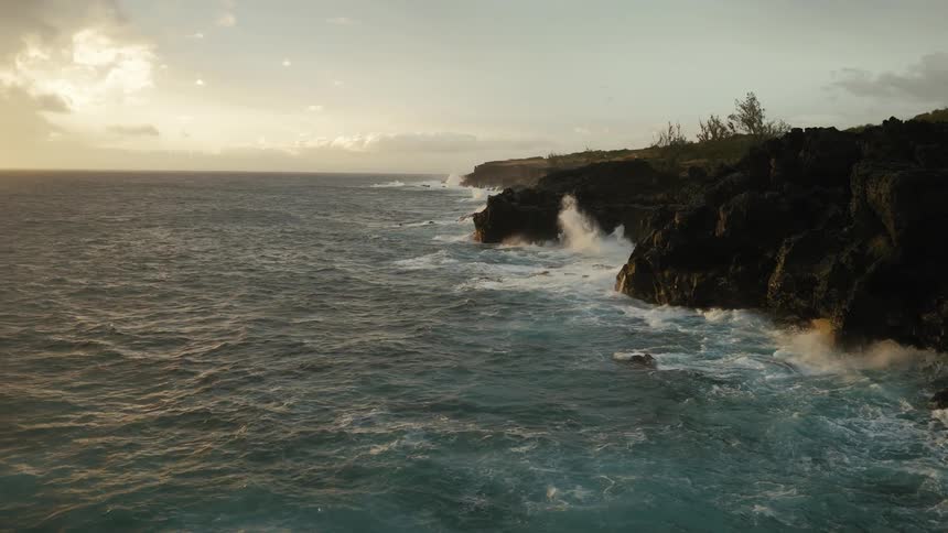 Ocean waves hit a rocky coastline