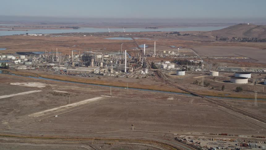Aerial of a power plant next to a river