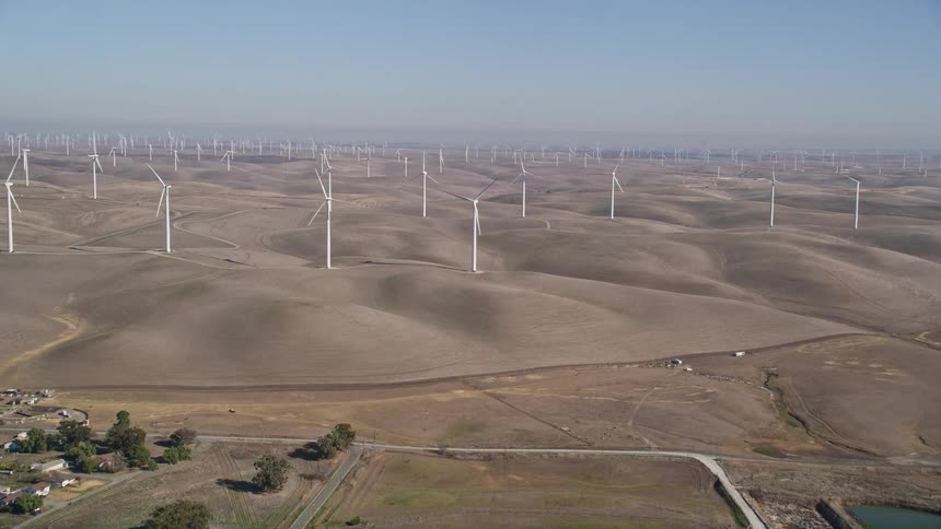 Aerial panorama of hills with a wind energy platforms