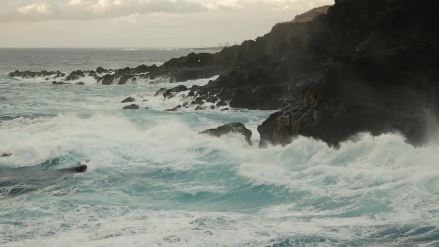 Strong waves batter a rocky coast