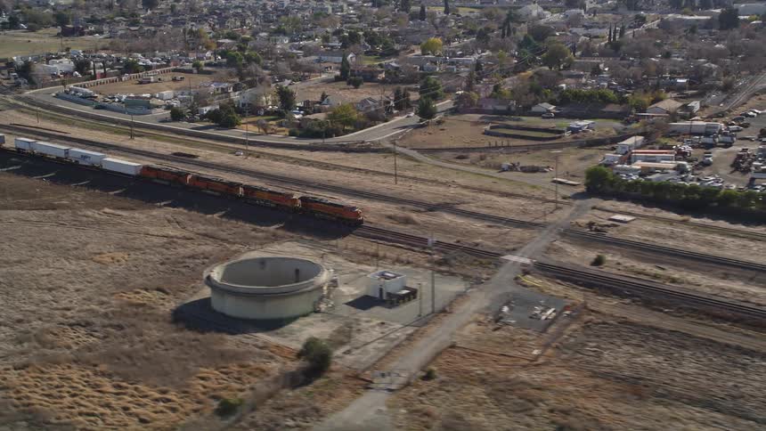 The train passes by the suburbs