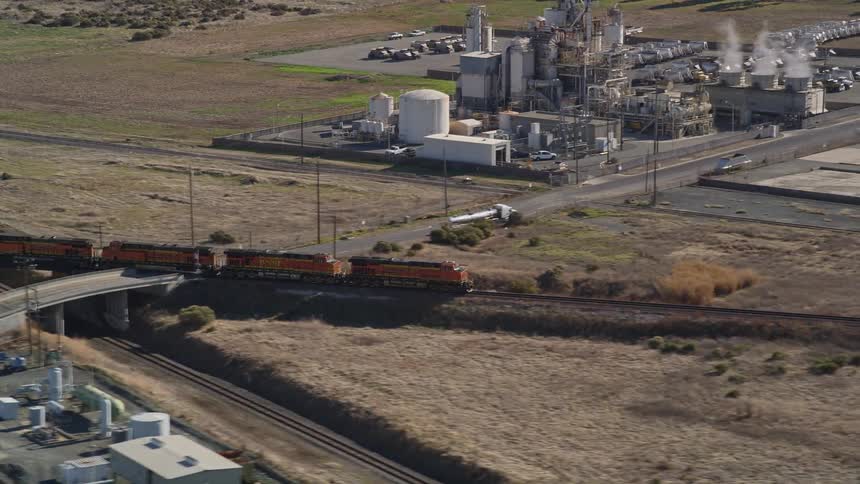 The train passes the factory