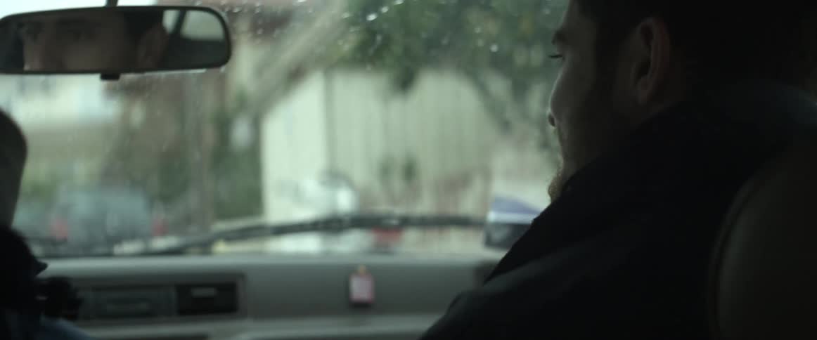 A man riding in a car