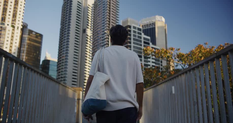 A man walks around looking at a city