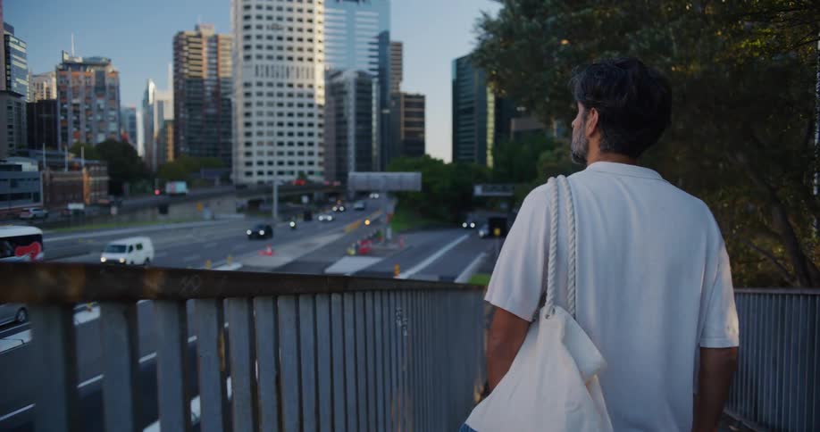 A man is walking through the city