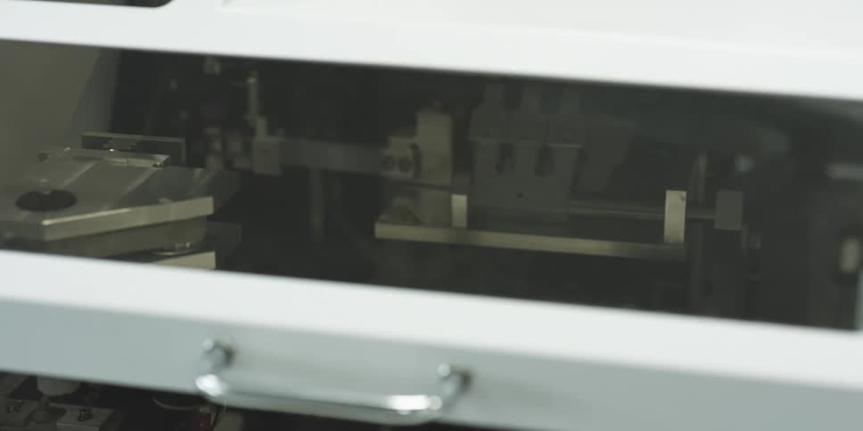 A machine runs inside a building