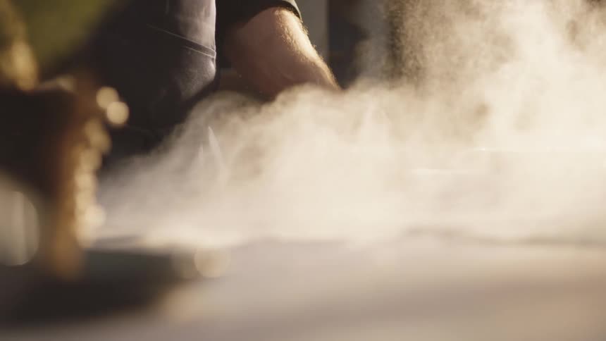 Man hand picking up flour and throwing it on the table