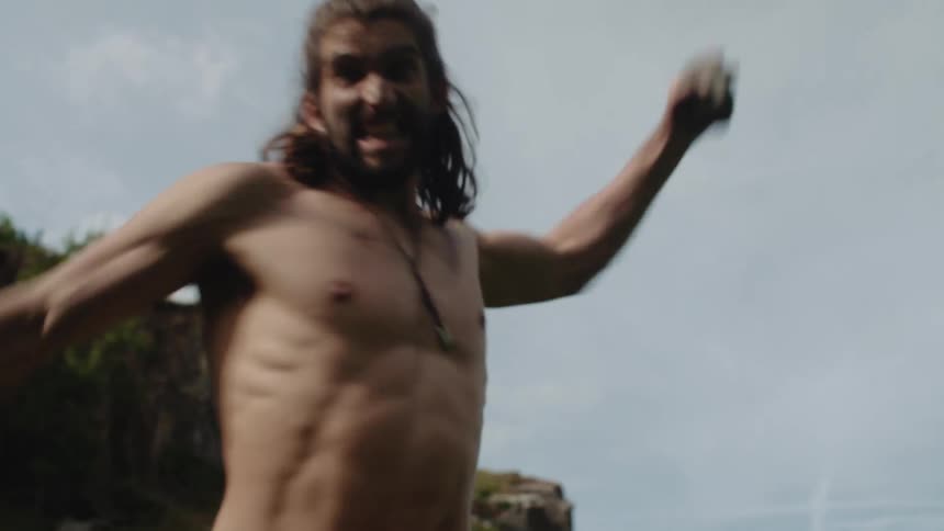 A man throws a rock