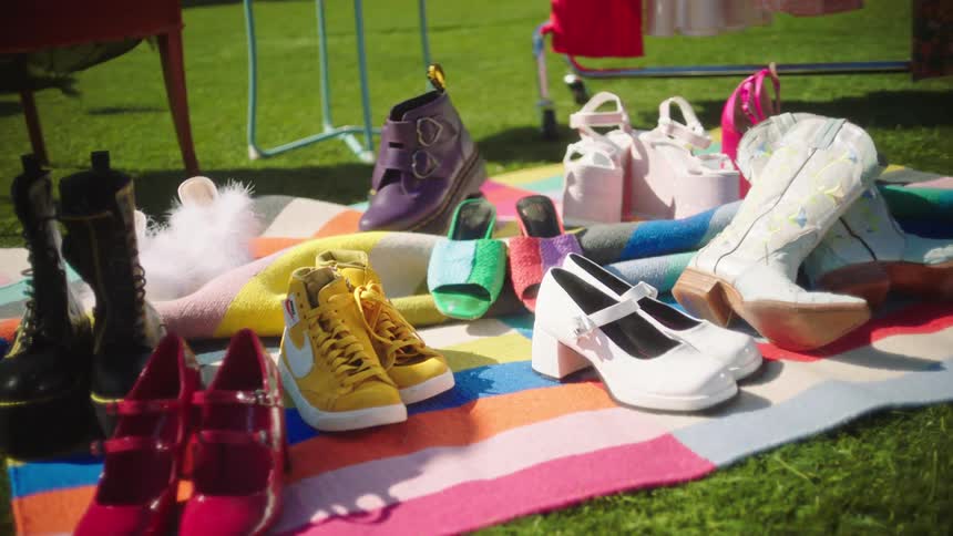 A number of pairs of shoes displayed on a blanket