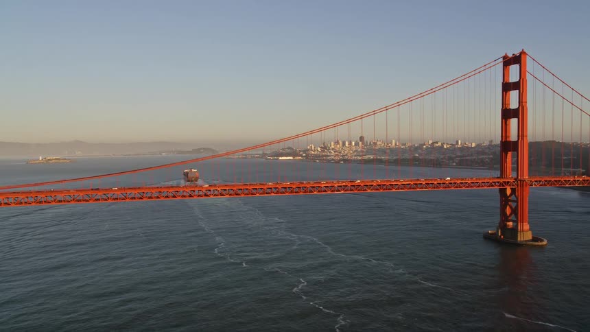 Cars travel across the iconic golden gate bridge on their way towards san francisco