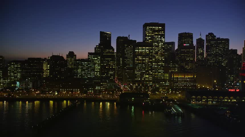 The san francisco waterfront and city skyline at dusk
