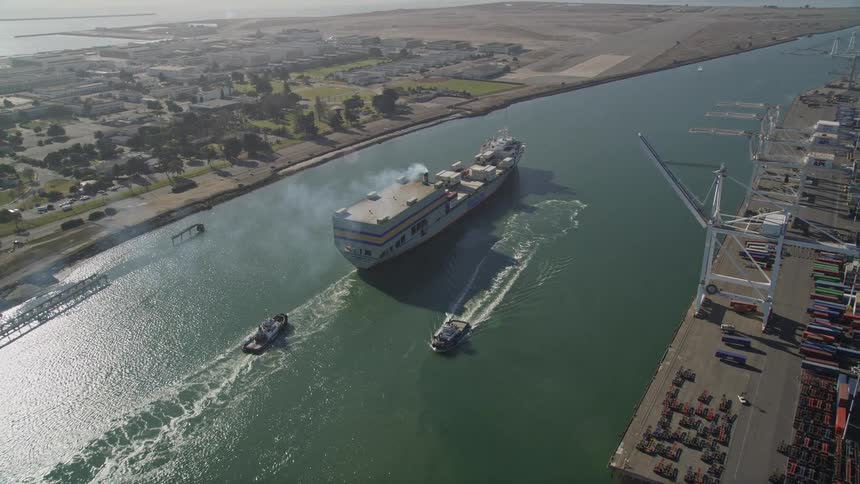 A large ship travels down the river