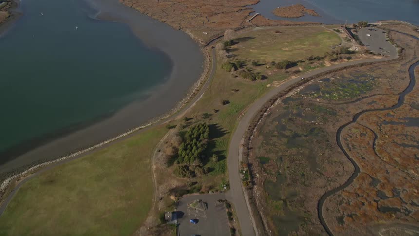 Aerial panorama of the coast of a peninsula with highways and surrounded by the sea