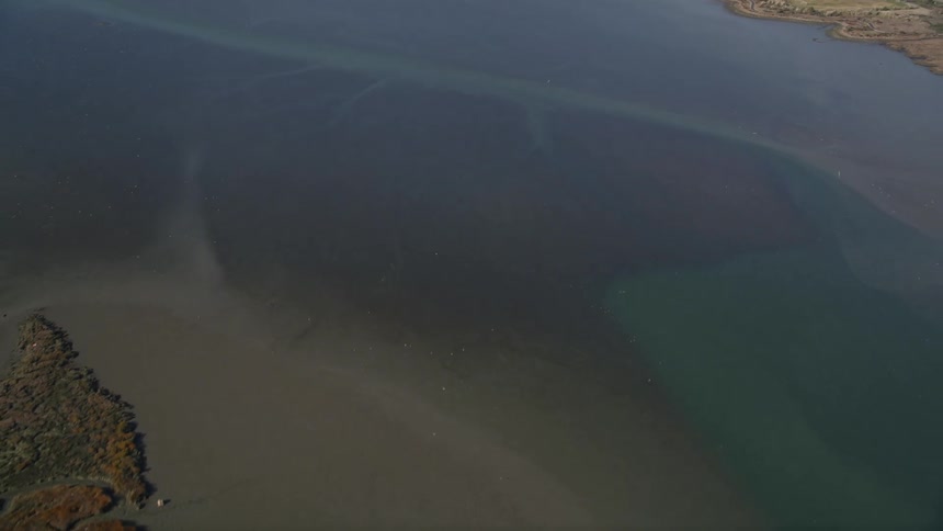 Aerial panorama of a calm sea with coastlines around
