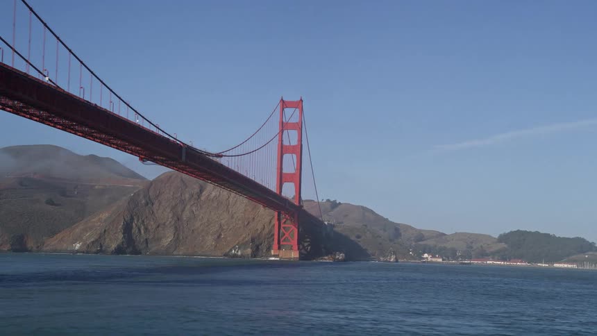 A large bridge covers the shore
