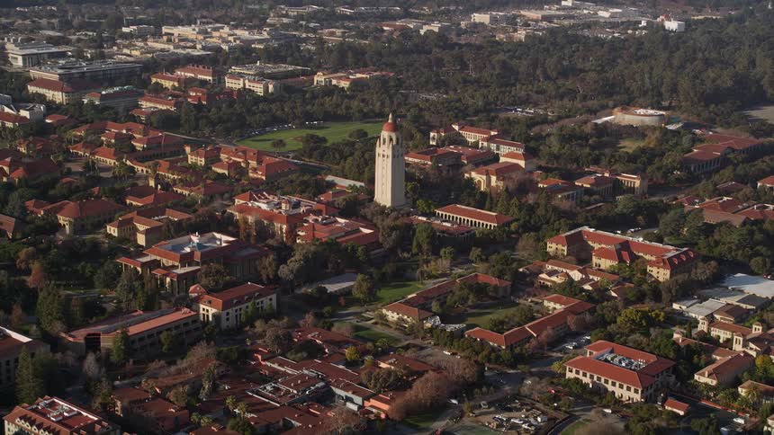 Aerial panorama of an urban city with a central pillar of a church