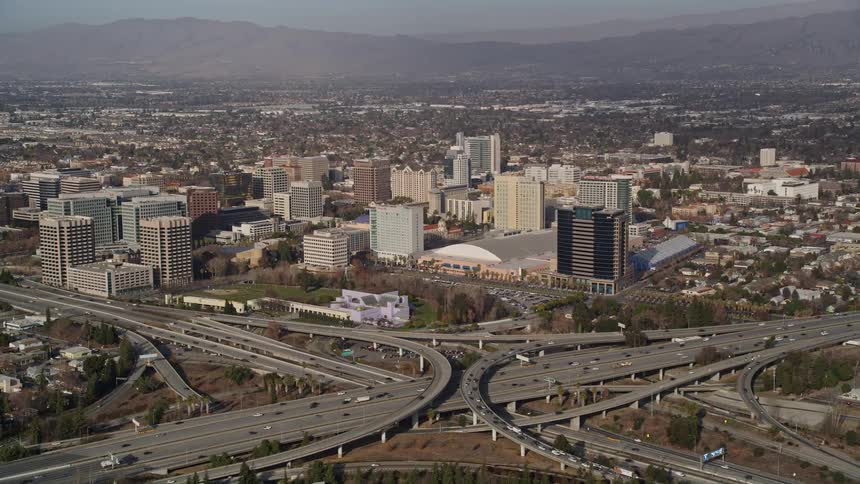 Traffic runs on the freeway by the city