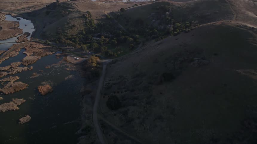Aerial scenery of mountain ranges and plateau with lake