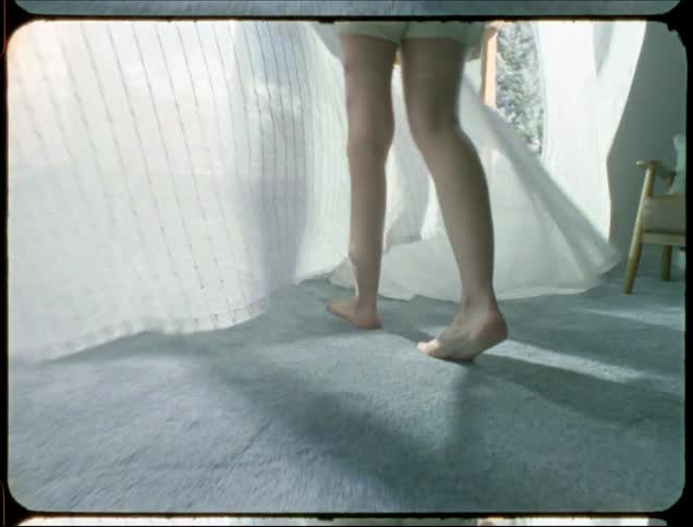 A woman walks up to the open window
