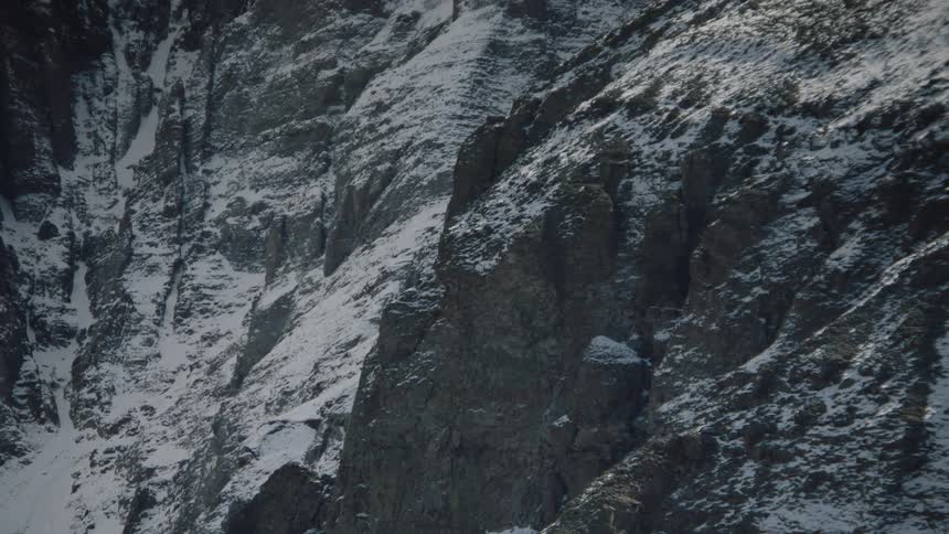 A snow dusted mountain slope in nature