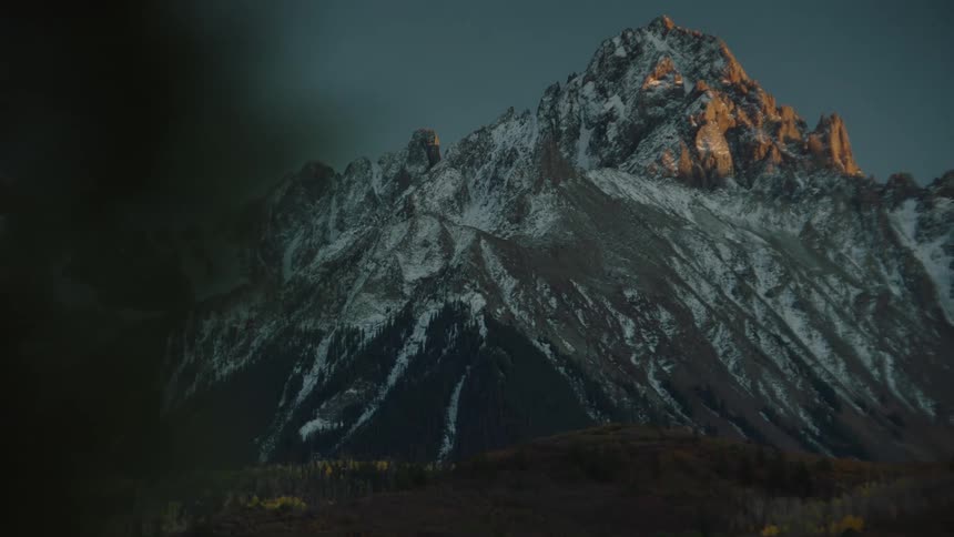 The mountain has snow on it