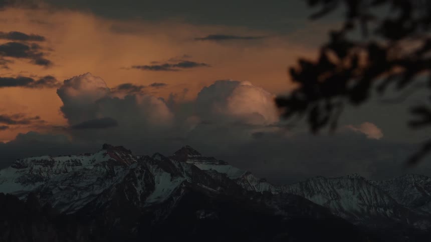 A mountain range landscape at sunset