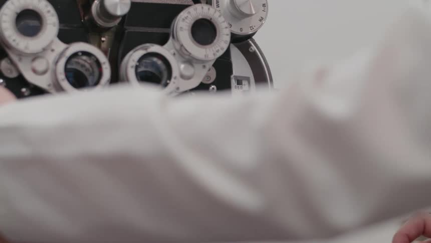 An ophthalmologist gives a patient an eye test