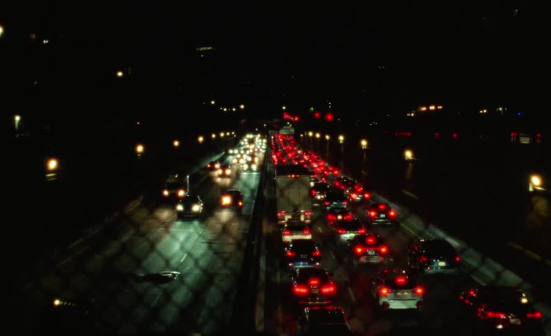 Heavy traffic is on the freeway at night
